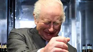 King Charles tapping beer