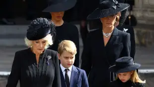 Queen Camilla, Duchess Kate, Prince George and Princess Charlotte at the funeral