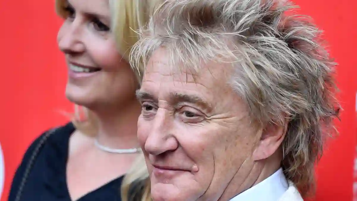 Rod Stewart and Penny Lancaster pose together at an event