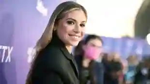 Christina Perri smiles for the camera on the red carpet