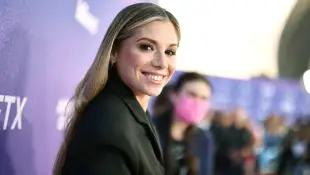 Christina Perri smiles for the camera on the red carpet