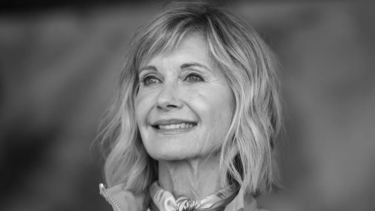 Olivia Newton-John smiles while she was alive