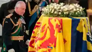 King Charles III in front of the Queen's coffin