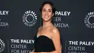 Duchess Meghan in a black dress
