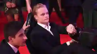 Princess Mette-Marit's son Marius Borg Høiby playing the Formula E simulator at the BRITS Aftershow Party