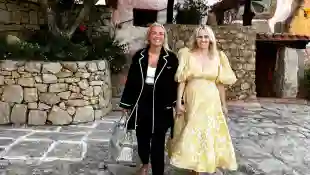 Rebel Wilson and her friend Ramona walk the streets of Italy holding hands