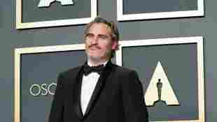 Joaquin Phoenix poses in the press room at the 2020 Oscars with the Best Actor trophy for ﻿Joker﻿.
