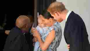 Prince Harry and Meghan holding their son Archie, meet Archbishop Desmond Tutu at the Desmond & Leah Tutu Legacy Foundation in Cape Town, South Africa, September 25, 2019.