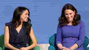 Duchess Meghan and Duchess Catherine laughing together