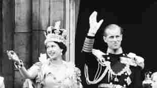 Queen Elizabeth II and Prince Philip wave to the crowd, June 2, 1953 after being crowned at Westminster Abbey in London.