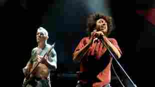 Musician Tim Commerford and singer Zack de la Rocha of Rage Against the Machine performs at L.A. Rising at the L.A. Memorial Coliseum on July 30, 2011 in Los Angeles, California