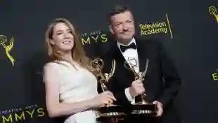 Annabell Jones and Charlie Brooker pose with the Outstanding Creative Achievement In Interactive Media Within A Scripted Program Award for 'Bandersnatch (Black Mirror)' in the press room during the 2019 Creative Arts Emmy Awards on September 15, 2019 in Los Angeles, California