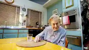Julia Child sits in her kitchen after being moved