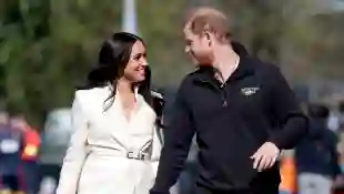 Body Language Expert Comments On Harry And Meghan's Recent PDA