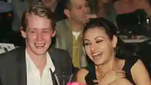 Actor Macaulay Culkin and actress Mila Kunis attend the launch of the "uBid for Hurricane Relief" charity auction and benefit at the Empire Ballroom 2005
