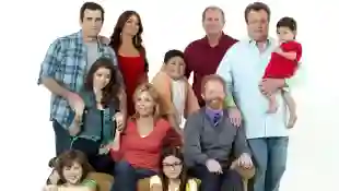`The cast of Modern Family poses with the Screen Actors Guild Award for Oustanding Performance by an Ensemble in a Comedy Series