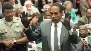 O.J. Simpson shows the jury a new pair of Aris ext