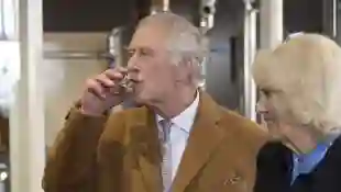 King Charles III samples gin during a visit to Yorkshire on April 06, 2023.
