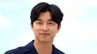 Why The Salesman In Squid Game Looks So Familiar Gong Yoo actor cast star Train to Busan movie film Netflix TV show series episode ddakji character 2021