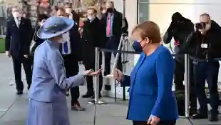 Angela Merkel's Awkward Fist Bump With Denmark's Queen Margrethe handshake fail video watch Danish royal family news latest 2021