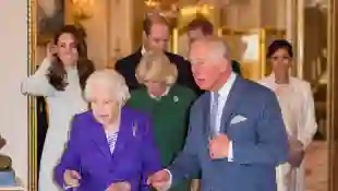 Duchess Catherine, Duchess Camilla, Prince William, Prince Harry, Queen Elizabeth II, Prince Charles and Duchess Meghan attend a reception to mark the fiftieth anniversary of the investiture of the Prince of Wales at Buckingham Palace
