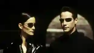 Carrie-Anne Moss ("Trinity") and Keanu Reeves as "Neo" in the 1999 worldwide hit The Matrix.