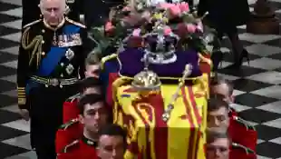 King Charles III behind the Queen's coffin