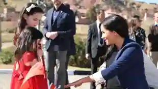 Prince Harry and Duchess Meghan meet Rania and Rayhana Minijam in Asni, Morocco