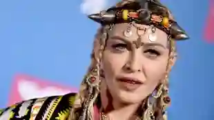 Madonna Postpones Tour After Suffering Serious Bacterial Infection File photo dated August 20, 2018 of Madonna poses bac