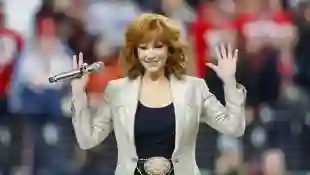 Country music icon and Grammy Award winner Reba McEntire sings the national anthem during the first quarter of Super Bow