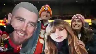 Syndication: USA TODAY Chiefs fans wave Taylor Swift and Travis Kelce cutouts at Arrowhead Stadium. , EDITORIAL USE ONLY