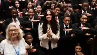 Duchess Meghan poses with school children during a visit to Robert Clack School in Dagenham, March 6, 2020.