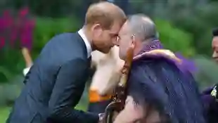 Prince Harry receives a 'hongi', or traditional Maori greeting, from an elder during an official welcoming ceremony at Government House in Wellington