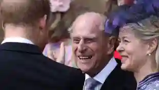 Britain's Prince Philip, Duke of Edinburgh reacts as he talks with Britain's Prince Harry, Duke of Sussex as they leave St George's Chapel in Windsor Castle, Windsor, west of London, on May 18, 2019