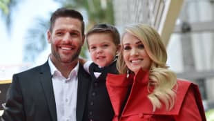 Carrie Underwood with husband Mike Fisher and their 3-year-old son Isaiah Michael 