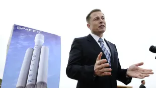 Elon Musk speaking at a 2011 SpaceX Press conference