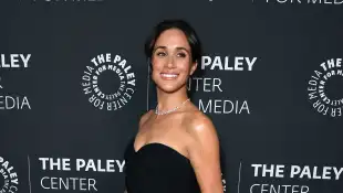 Duchess Meghan in a black dress
