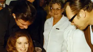 JUNE CARTER CASH AND HUSBAND JOHNNY CASH.WITH THEIR NEW BABY.