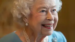 Queen Elizabeth II now selling dog cologne happy hounds news latest royal family 2022