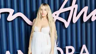 Sienna Miller with white maternity dress