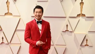 Simu Liu arrives for the 94th annual Academy Awards at the Dolby Theatre in the Hollywood section of Los Angeles on Sund