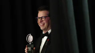 Sean Hayes, winner of the award for Best Performance by a Leading Actor in a Play for Good Night, Oscar, holds a Tony Aw