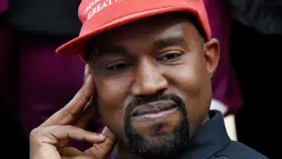 Donald Trump And Kanye West Meet - Washington Artist Kanye West looks on in the Oval Office of the White House during a