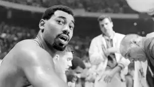 Philadelphia  76'ers,  Wilt  Chamberlain  (#13),  during  game  against  Boston  Celtics,  in  the