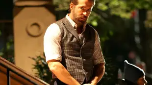 Director John Krasinski pictured in a dinosaur halloween costume, before wrapping film production with Ryan Reynolds and