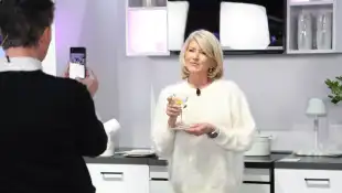 Celebrtiy chef Martha Stewart is seen taking photos with a martini glass, after a cooking demonstration at the Samsung b