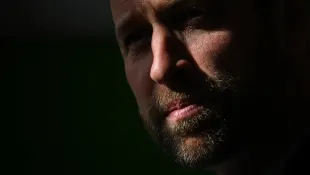 Britain s Prince William, Prince of Wales uses a special dust to reveal finger print as he attends a CSI training exerci