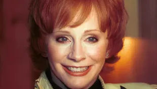Country and western singer Reba McEntire poses after performing a selection from "Annie Get Your Gun," January 9, 2001