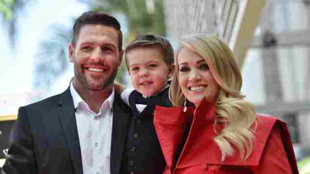 Carrie Underwood with husband Mike Fisher and their 3-year-old son Isaiah Michael