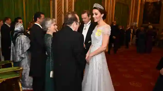 Kate in a stunning off-white gown at Buckingham Palace